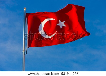 Turkish flag on a background of blue sky close-up