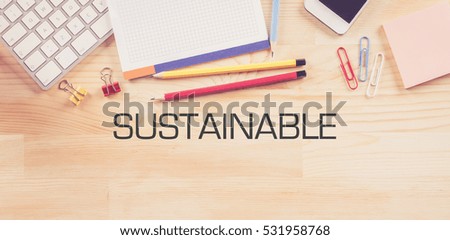 Business Workplace with  SUSTAINABLE Concept on Wooden Background