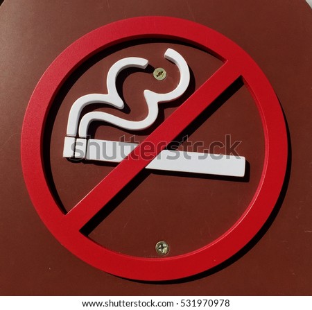 No smoking signs posted at the park.