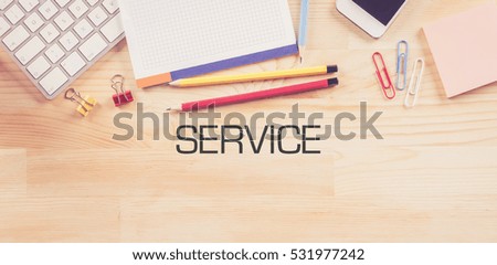 Business Workplace with  SERVICE Concept on Wooden Background