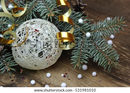 Christmas tree with a ball made of yarn. Christmas decoration