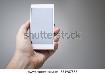 Male hand holding smart phone device