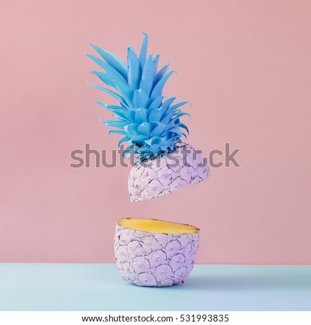 Pink pineapple on yellow background. Minimal style. Food concept.