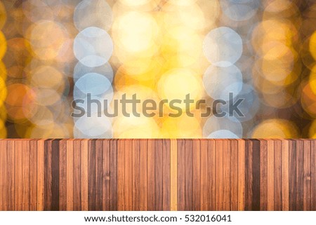 Empty top wooden table and blurred image of christmas lighting bokeh background. for your product display