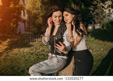 Girls walking around town, sit in cafes and pictures on phones