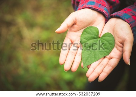 Go green, Earth day, Plant.Woman hands with green leaf with heart shape.Climate change.Green Heart.Love the earth.World environment day.Eco save.Green energy clean natural energy.CSR, Sustainable. Royalty-Free Stock Photo #532037209
