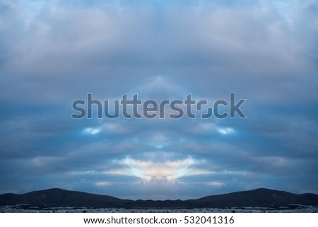 Atlantic Ocean with dramatic blue sky and clouds. Cruising along Islands, view from cruise ship, image with symmetry filter effect for tourism business concept, travel blogs, creative photo website