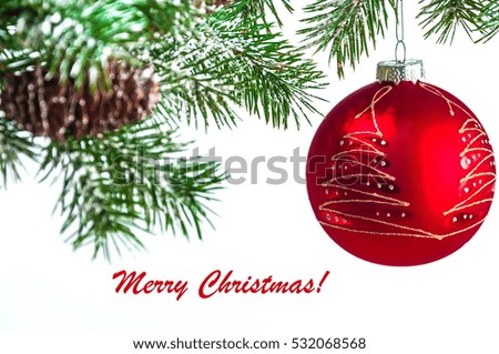 Red Xmas ball on fir branch close-up, isolated on white background, space for text Christmas card