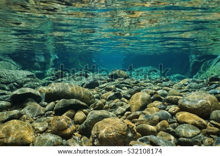 Rocks underwater on riverbed with clear freshwater, Dumbea river, Grande Terre, New Caledonia Royalty-Free Stock Photo #532108174