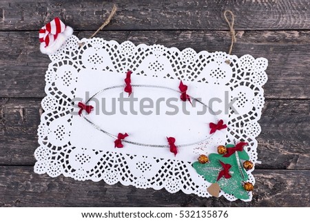 Christmas, pure white napkin, placed on a wooden, vintage look background (rotated image)