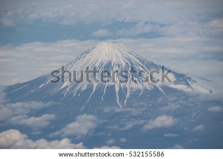 Beautiful  snowing Mt. Fuji from airplane window in  japan. 