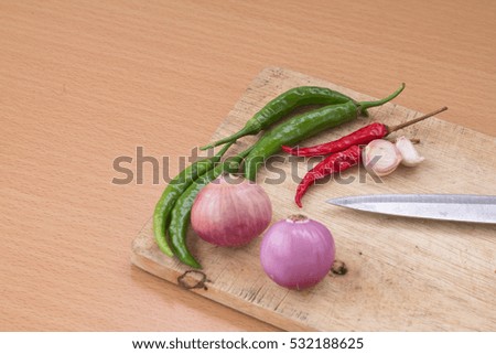 Thai spices with ingredients on wooden background