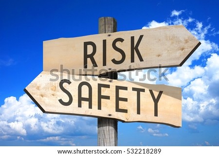 Risk, safety - wooden signpost