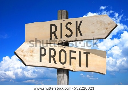 Risk, profit - wooden signpost