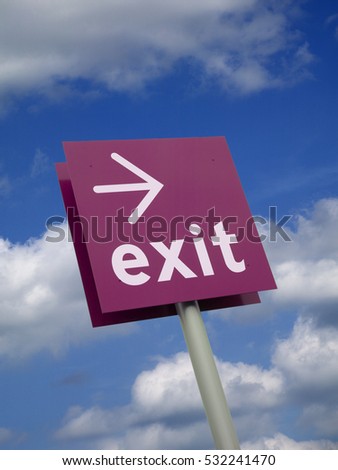 PURPLE  EXIT SIGN WITH BLUE SKY BACKGROUND