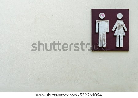 Toilet label on concrete wall