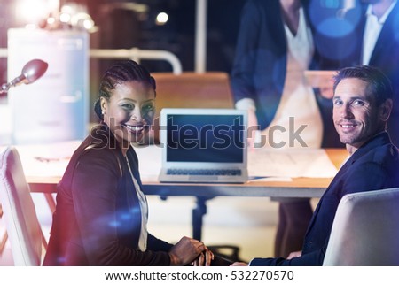 3D Portrait of businessman and businesswoman sitting at their desk in office