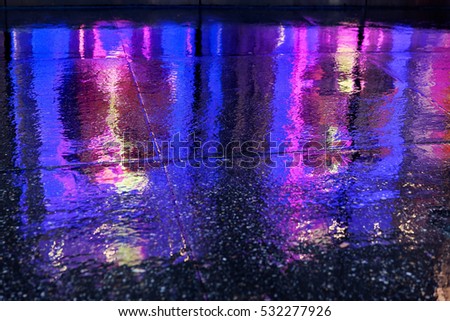 bright colorful reflection of city lights in rainy weather