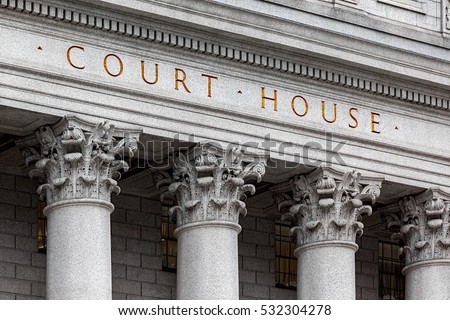 inscription on the courthouse close-up Royalty-Free Stock Photo #532304278