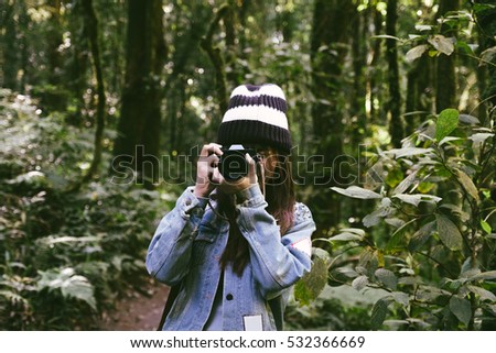 Hipster Young Beautiful Asian Girl Shoot Photograph from her Camera in the Jungle
