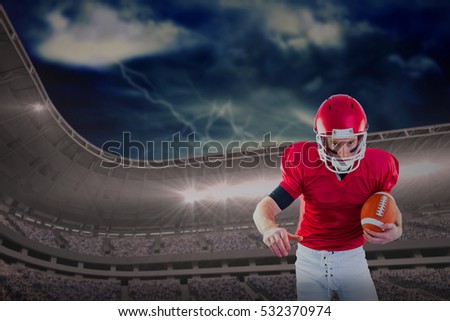 3D Portrait of focused american football player being ready to attack against scenic view of mountain during tornado