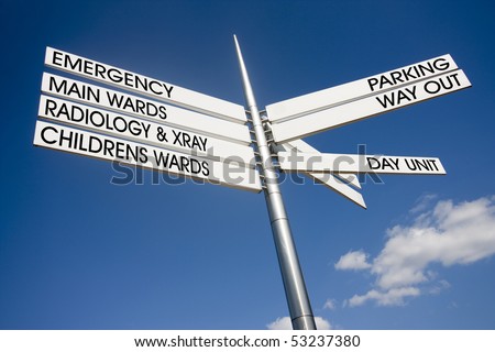 hospital signage pointing different directions for wards