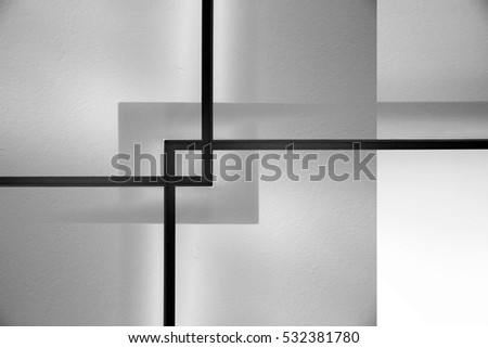 Double exposure close-up photo of minimalist interior fragment featuring transparent partitions and plastered wall behind them. Abstract background on the subject of modern architecture.