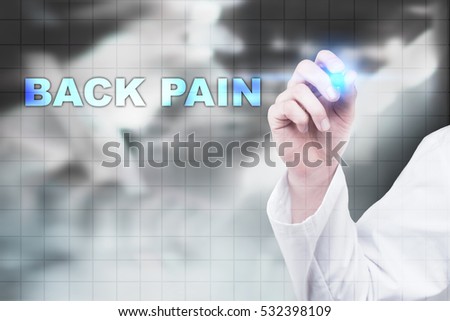 Medical doctor drawing back pain on virtual screen.