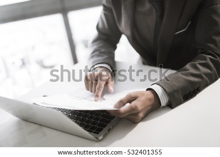 Businessman analyzing investment charts. Financial Report Revenue Statistical Accounting Concept