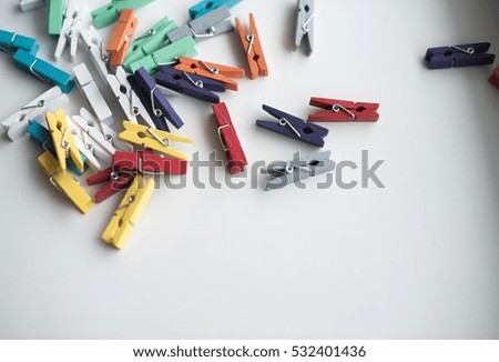 Decorative clothespins. Clothes pegs on a white background. Pins as background