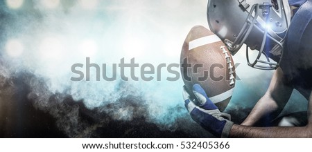 3D Close-up of upset American football player with ball against digitally generated image of color powder