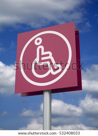 RECTANGULAR PURPLE SIGN WITH WHITE ICON OF DISABLED PERSON IN WHEELCHAIR
