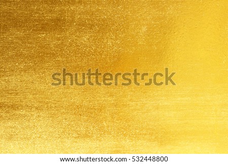 Shiny yellow leaf gold foil texture background Royalty-Free Stock Photo #532448800