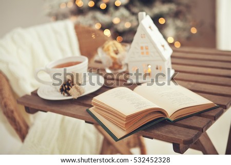 Christmas or new year decoration on modern wooden coffee table. Living room interior and holiday home decor concept. Toned picture
