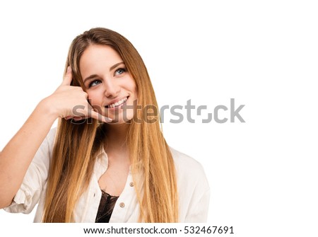 pretty young woman doing calling gesture