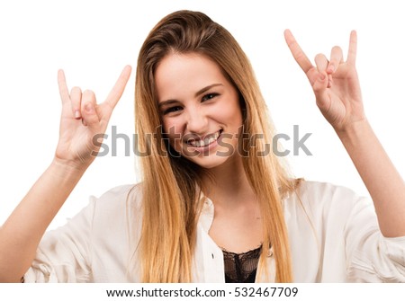 pretty young woman doing rock gesture