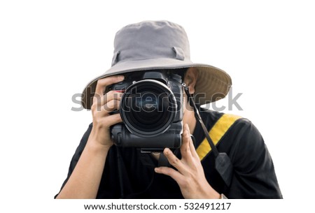 Young man with professional camera on white background.