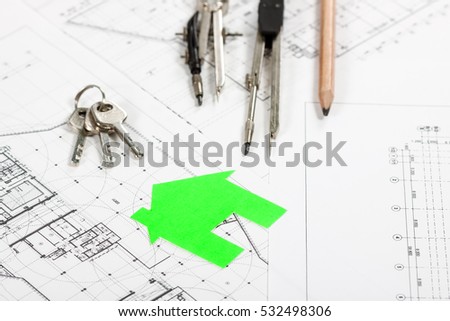 Architect workplace top view. Architectural project, blueprints, calculator, green model house, keys, divider compass and pencil on desk table. Real Estate Concept.
