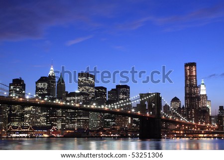 New York City Skyline and Brooklyn Bridge At Night