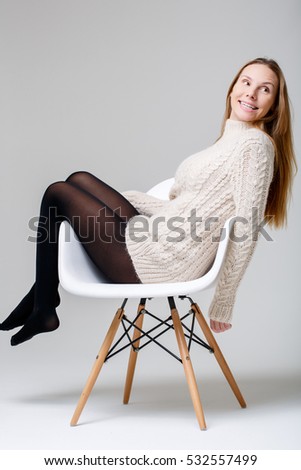 Young woman sitting in studio