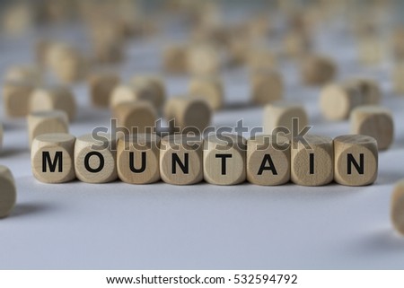 mountain - cube with letters, sign with wooden cubes
