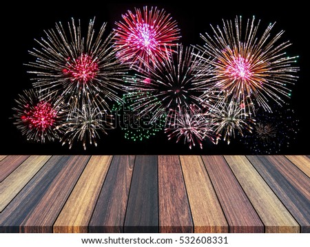Wood floor with defocused abstract city night lights with fireworks background