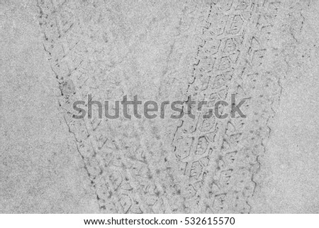 Grunge black tire track on white background, texture


