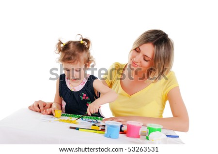 a young mom and her little daughter paint colors in this album