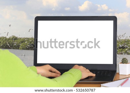 freelance desktop with open laptop compute on natural background