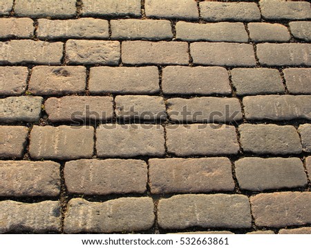 Pavement texture. Background of old cobblestone pavement. Pavement road, stone.