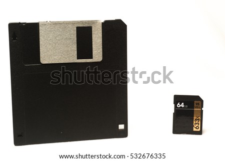 Old Floppy Disks with SD card isolated on white backgrounds
