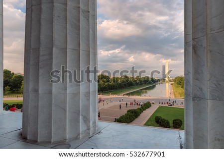 Washington DC skyline. Columns of Lincoln Memorial with Washington Monument.