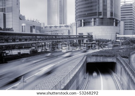 Traffic in modern city with cars motion in daytime.
