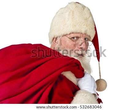 Authentic looking santa claus with real beard with gifts and christmas list shot in studio isolated on white background